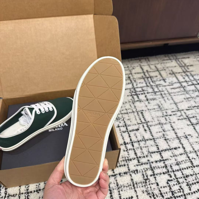 PRADA 26S LACE UP SNEAKERS IN DARK TEAL CANVAS