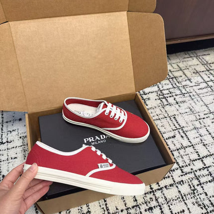 PRADA 26S LACE UP SNEAKERS IN RED CANVAS