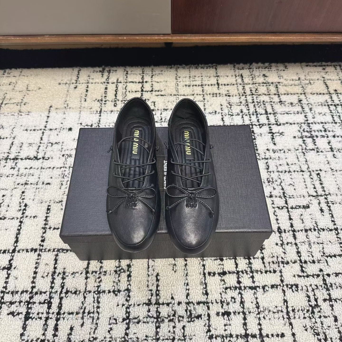 MIUMIU 26S LACE UP BOW LOAFERS IN BLACK CALFSKIN