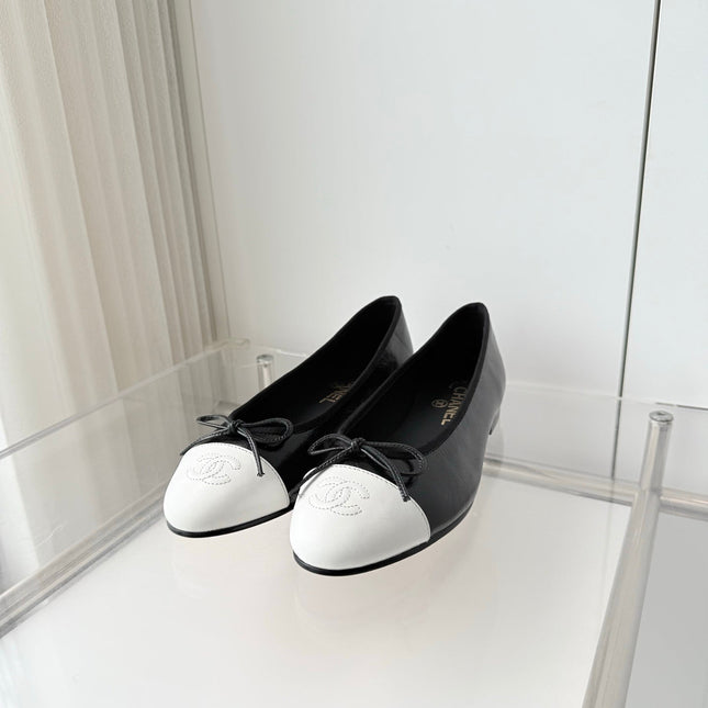 CHANEL 26S BALLET FLATS IN BLACK CRACKED CALFSKIN WITH WHITE TOE CAP AND BOW
