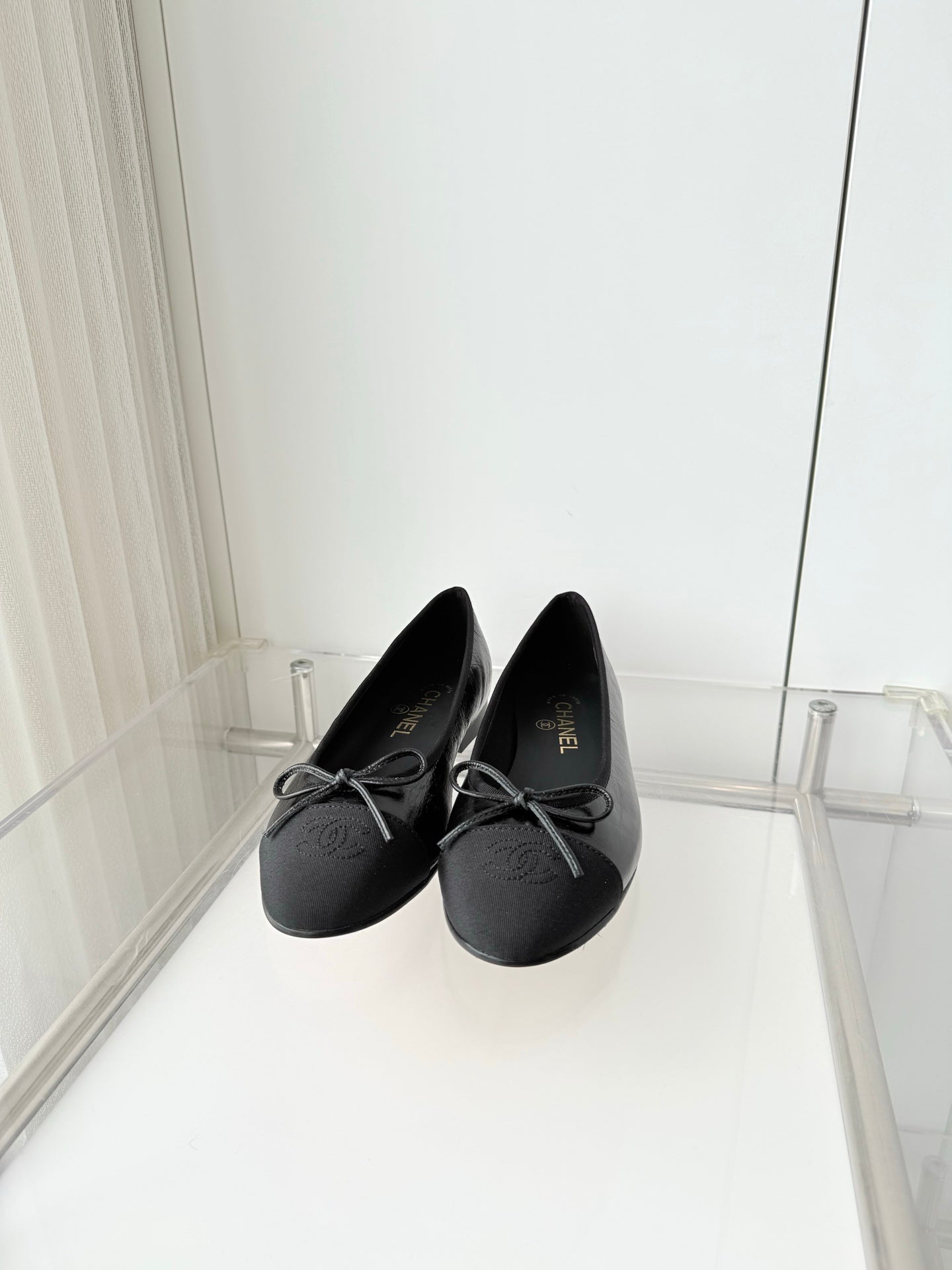 CHANEL 26S BALLET FLATS IN BLACK CALFSKIN WITH FABRIC TOE CAP AND BOW