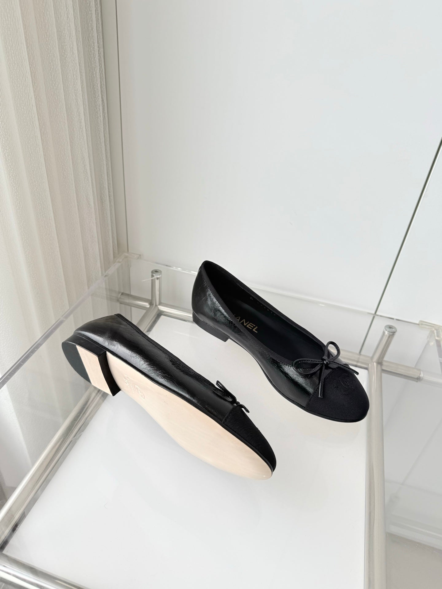 CHANEL 26S BALLET FLATS IN BLACK CALFSKIN WITH FABRIC TOE CAP AND BOW