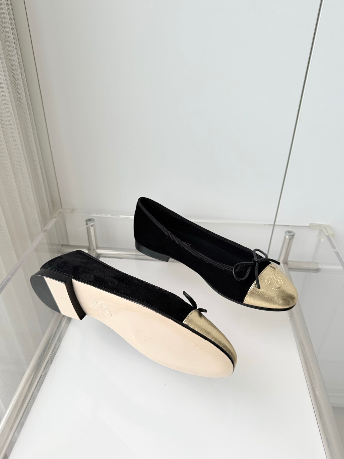 CHANEL 26S BALLET FLATS IN BLACK SUEDE WITH GOLD TOE CAP AND BOW