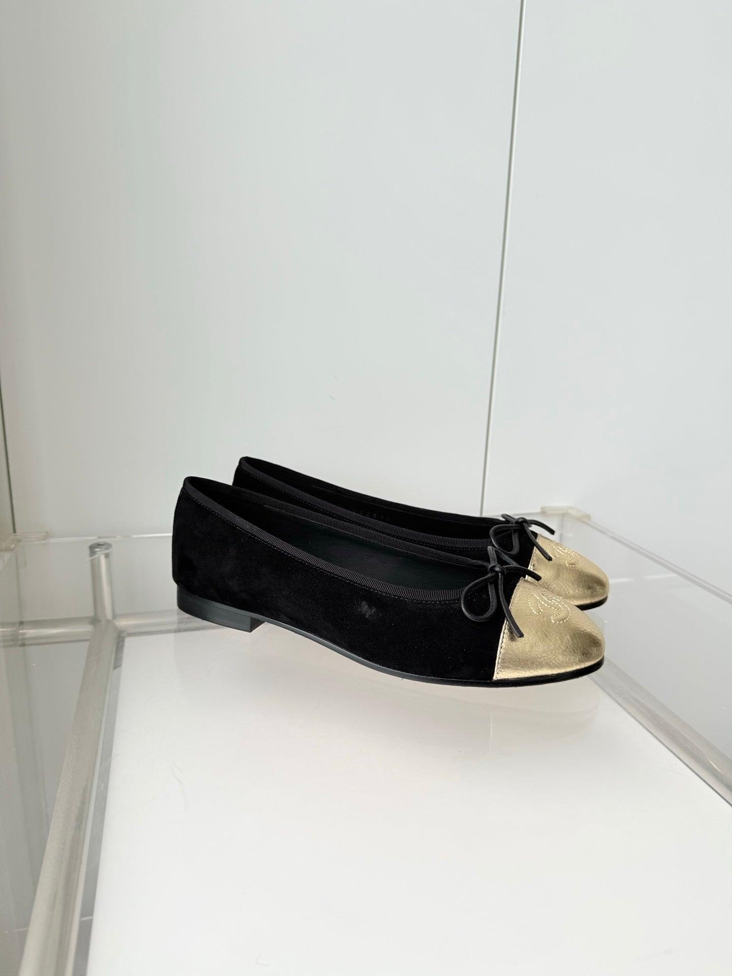 CHANEL 26S BALLET FLATS IN BLACK SUEDE WITH GOLD TOE CAP AND BOW