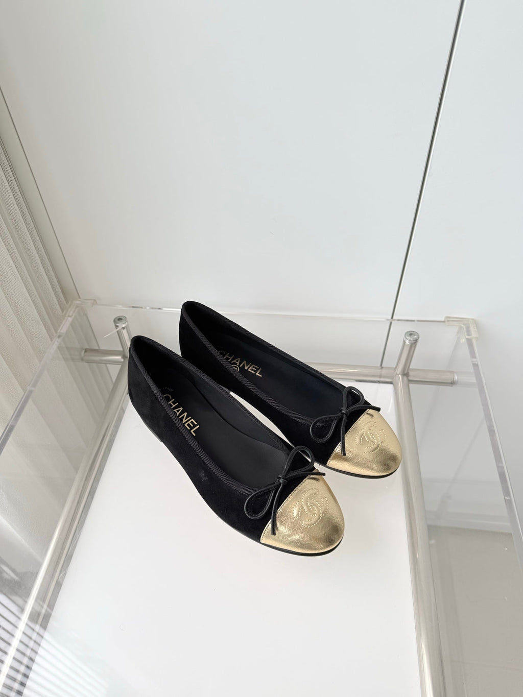 CHANEL 26S BALLET FLATS IN BLACK SUEDE WITH GOLD TOE CAP AND BOW