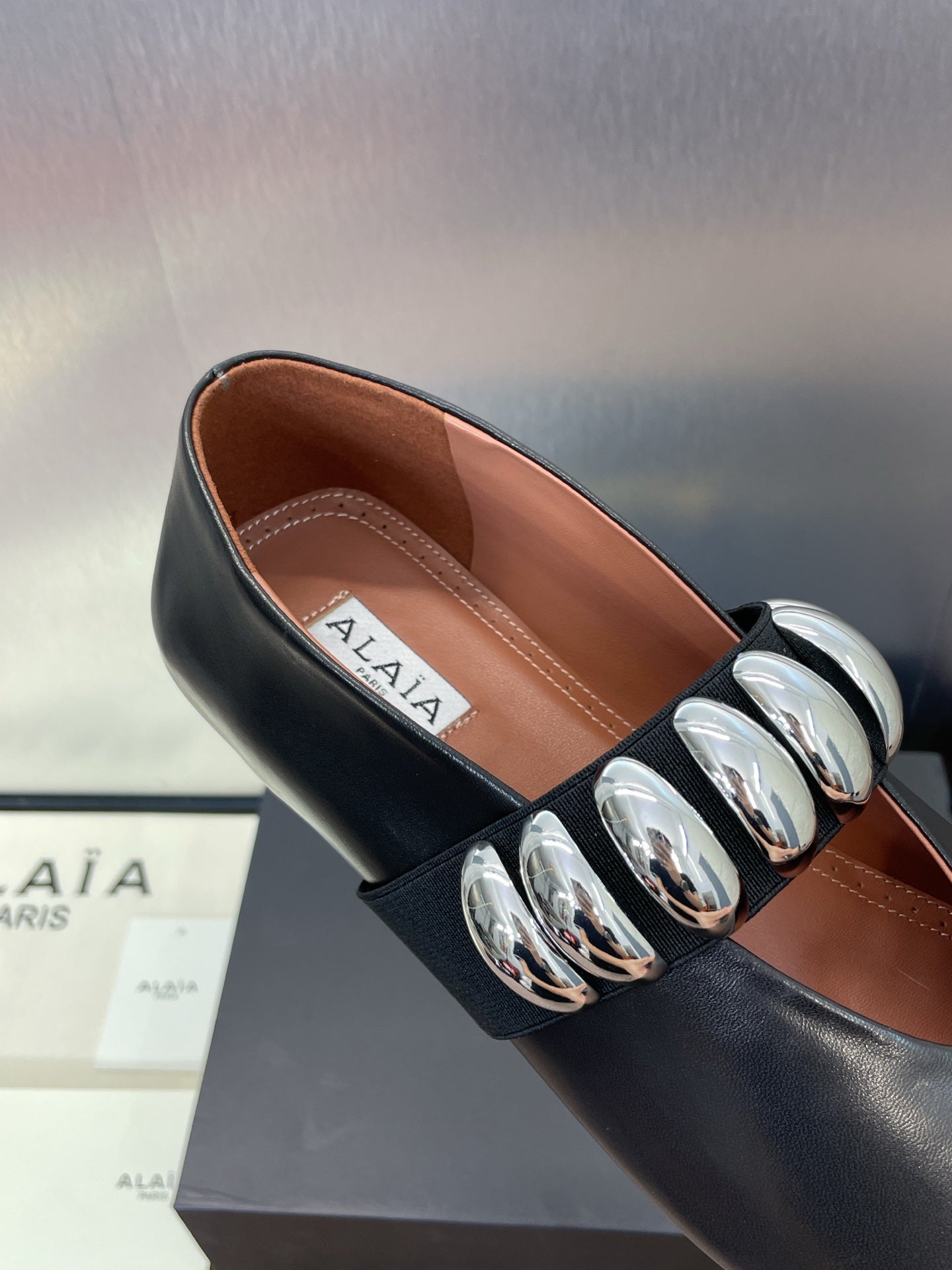 ALAIA MARY JANE FLATS 25S IN BLACK CALFSKIN WITH SILVER HARDWARE