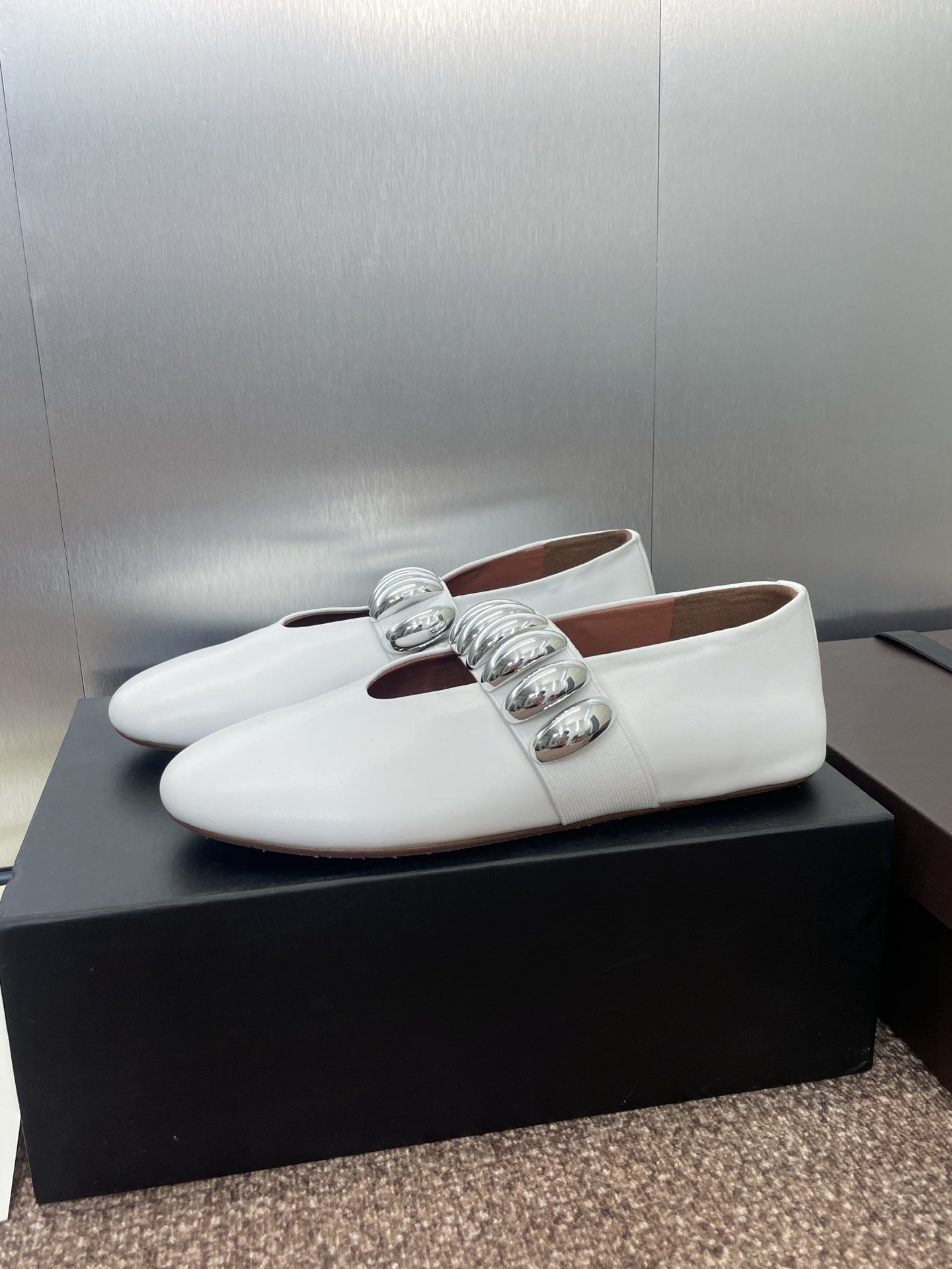 ALAIA MARY JANE FLATS 25S IN WHITE CALFSKIN WITH SILVER HARDWARE
