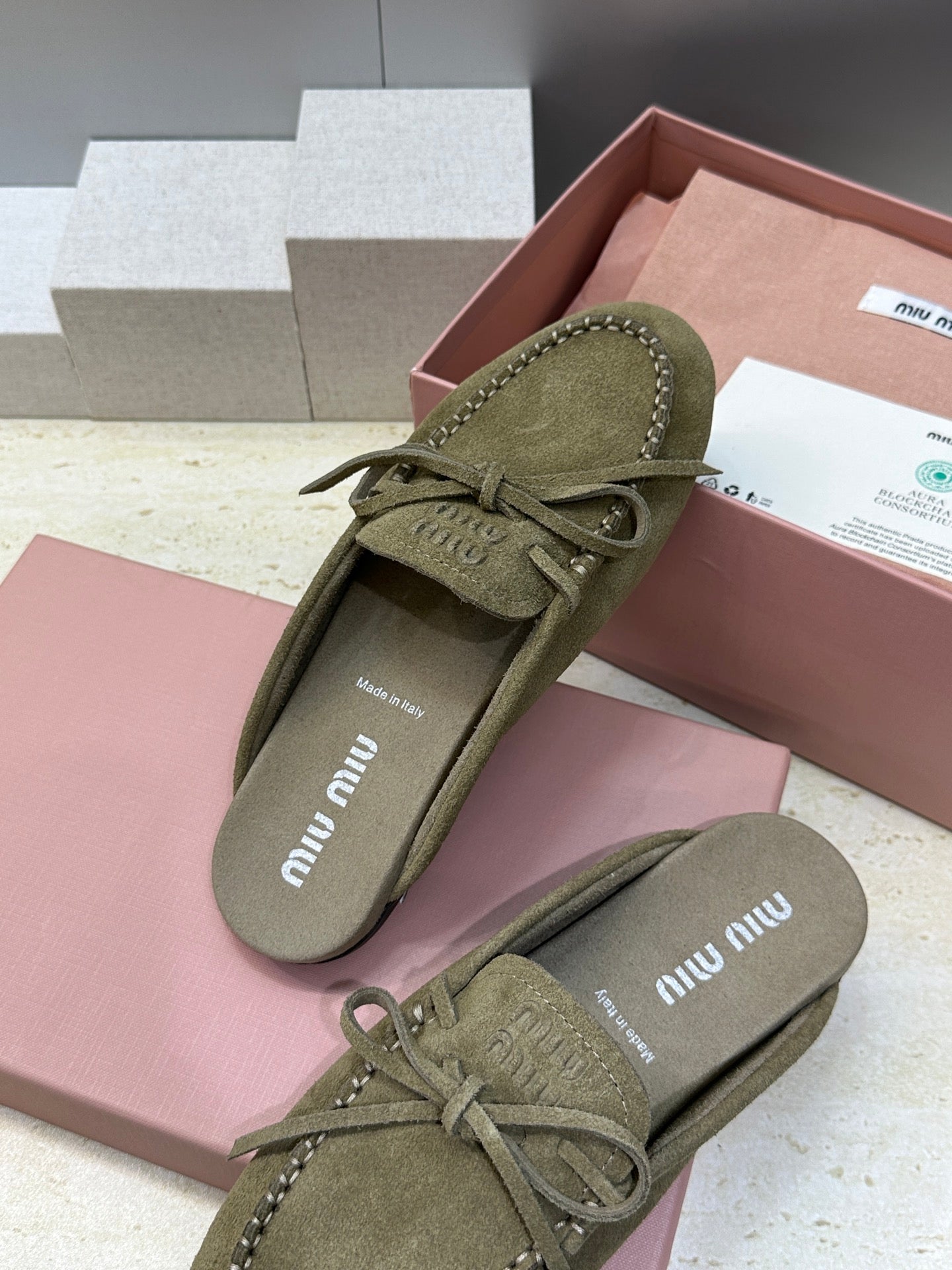 MIUMIU 26S SNEAKER MULES IN DARK OLIVE GREEN SUEDE WITH BOW