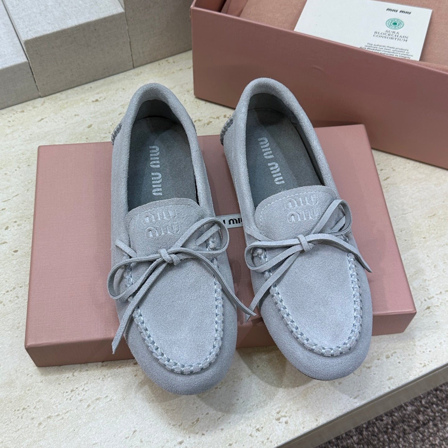 MIUMIU 26S LOAFERS IN LIGHT BLUE SUEDE WITH BOW