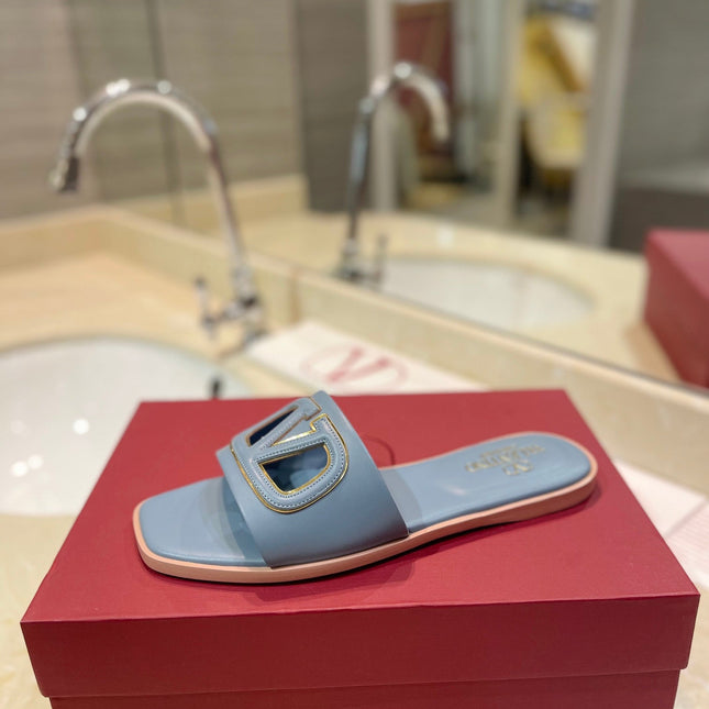VALENTINO 26S SLIDES IN PASTEL BLUE CALFSKIN WITH LOGO