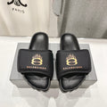 SLIDE SANDALS IN BLACK NYLON AND RUBBER YELLOW PRINT