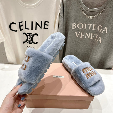 MIUMIU 26S FLAT SLIDES IN PASTEL BLUE SHEARLING