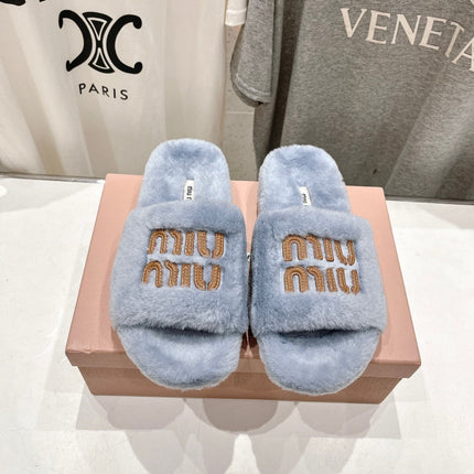 MIUMIU 26S FLAT SLIDES IN PASTEL BLUE SHEARLING