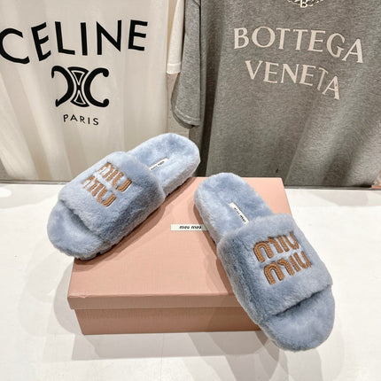MIUMIU 26S FLAT SLIDES IN PASTEL BLUE SHEARLING