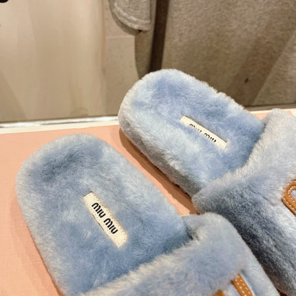 MIUMIU 26S FLAT SLIDES IN PASTEL BLUE SHEARLING