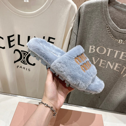 MIUMIU 26S FLAT SLIDES IN PASTEL BLUE SHEARLING