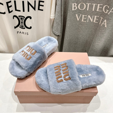 MIUMIU 26S FLAT SLIDES IN PASTEL BLUE SHEARLING