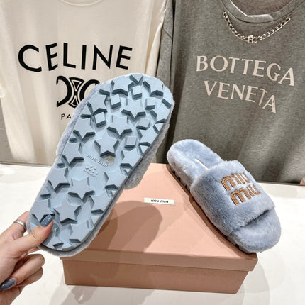 MIUMIU 26S FLAT SLIDES IN PASTEL BLUE SHEARLING