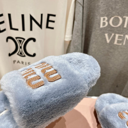 MIUMIU 26S FLAT SLIDES IN PASTEL BLUE SHEARLING