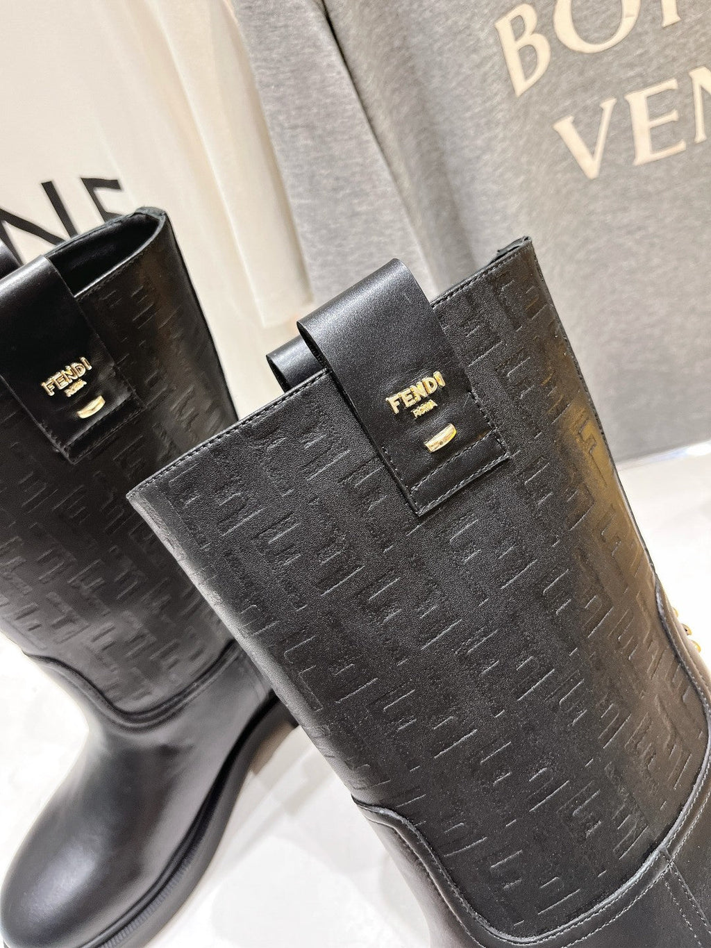 FENDI 25S ANKLE BOOTS IN BLACK COWHIDE LOGO EMBOSSING