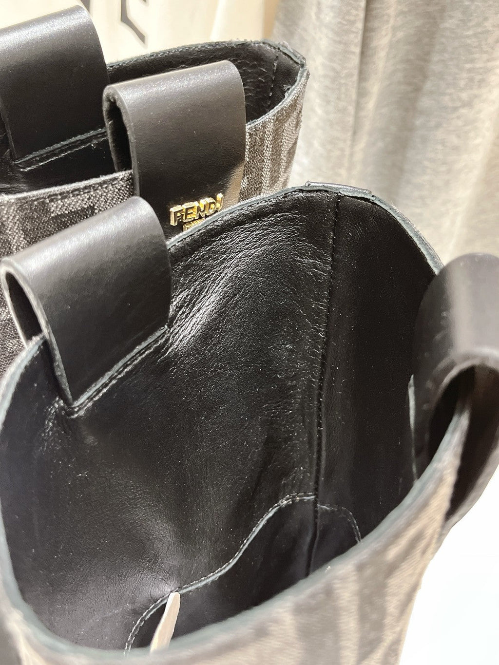 FENDI 25S ANKLE BOOTS IN BLACK COWHIDE AND CANVAS LOGO EMBOSSING