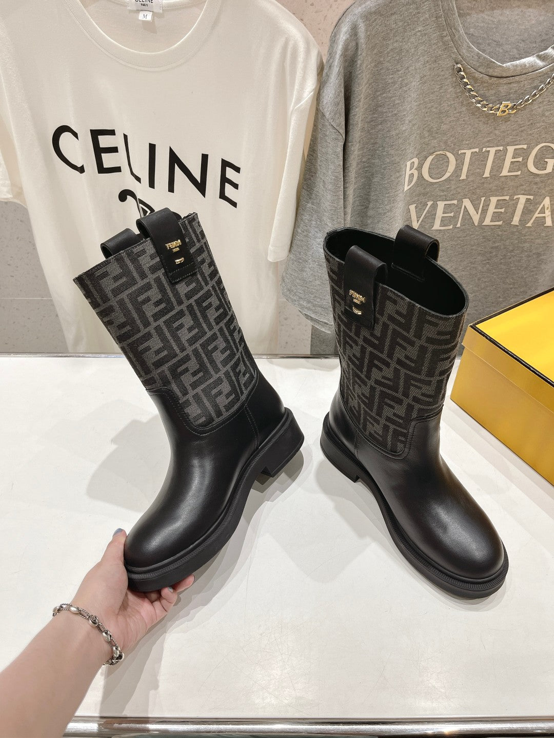 FENDI 25S ANKLE BOOTS IN BLACK COWHIDE AND CANVAS LOGO EMBOSSING