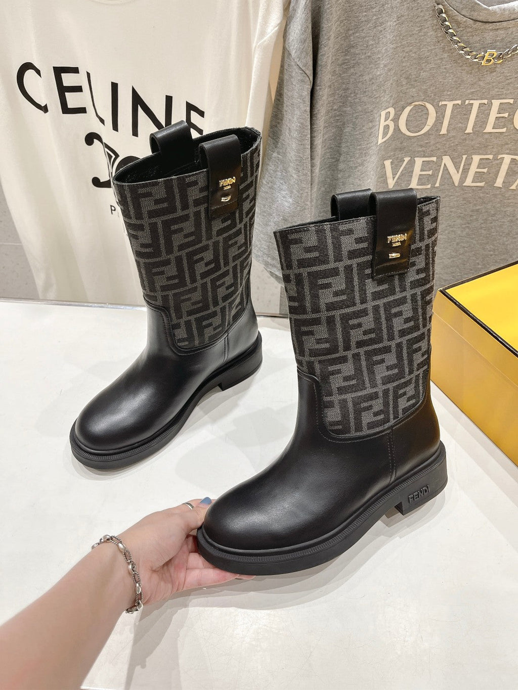 FENDI 25S ANKLE BOOTS IN BLACK COWHIDE AND CANVAS LOGO EMBOSSING