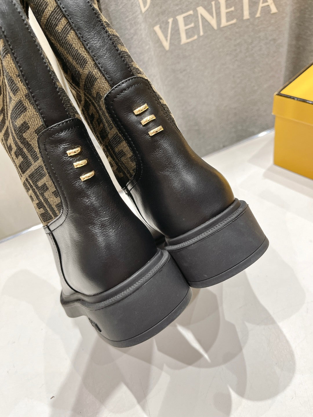 FENDI 25S ANKLE BOOTS IN BLACK COWHIDE AND BROWN CANVAS LOGO EMBOSSING