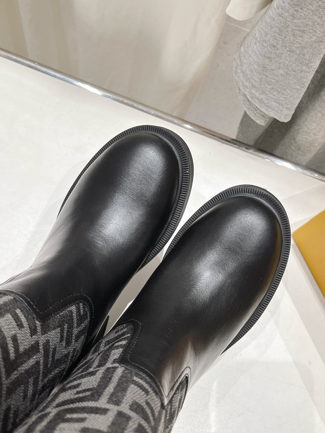 FENDI 25S HIGH BOOTS IN BLACK COWHIDE AND CANVAS LOGO EMBOSSING