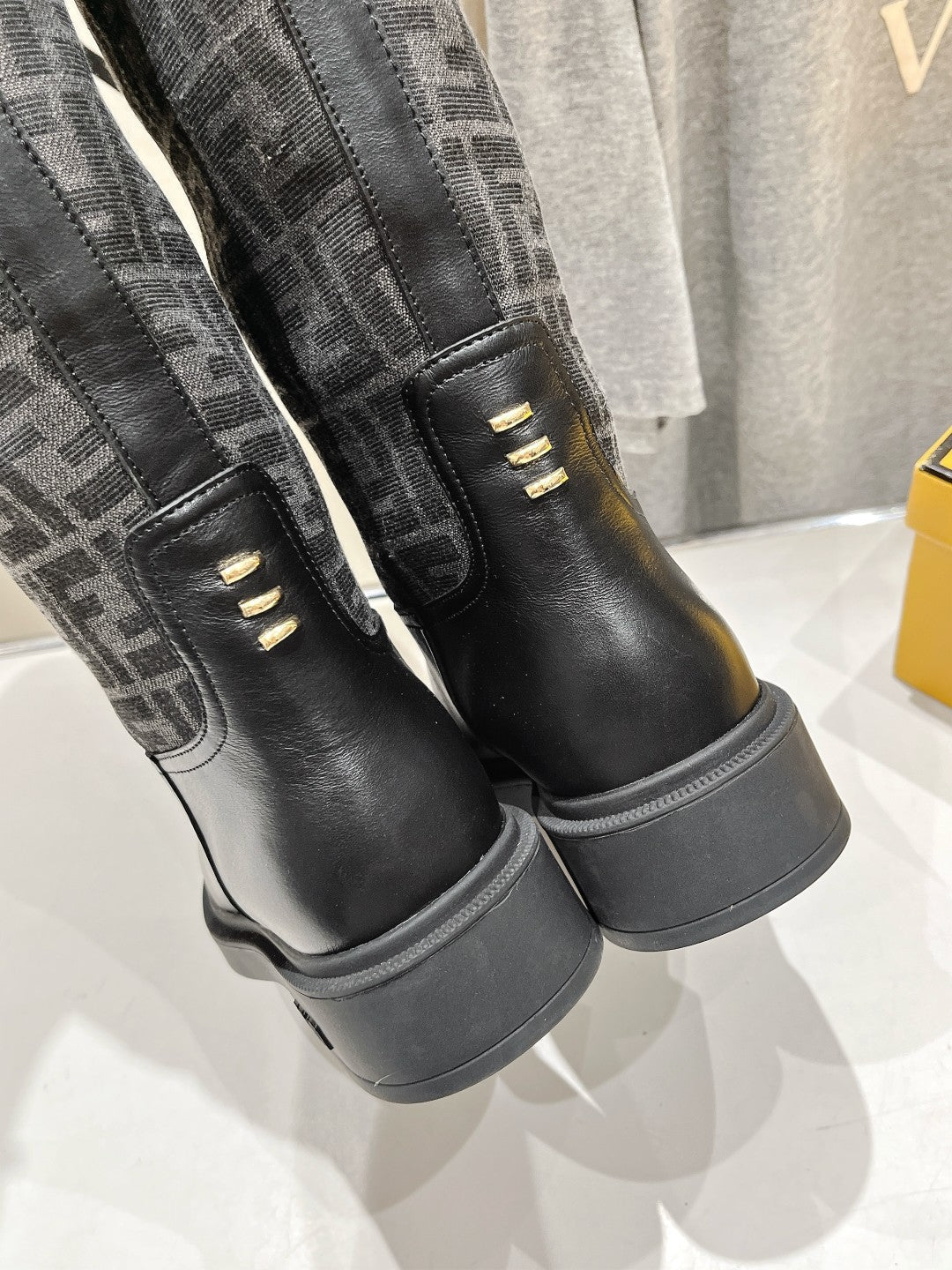 FENDI 25S HIGH BOOTS IN BLACK COWHIDE AND CANVAS LOGO EMBOSSING