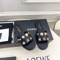 CHANEL 26S FLAT SANDALS IN BLACK LAMBSKIN CHARM-DECORATED