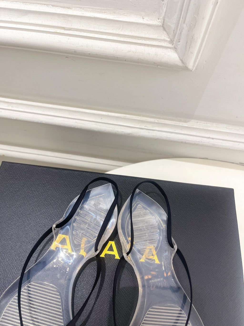 ALAIA 26S POINTED-TOE THONG SANDALS IN BLACK SATIN AND TRANSPARENT PVC