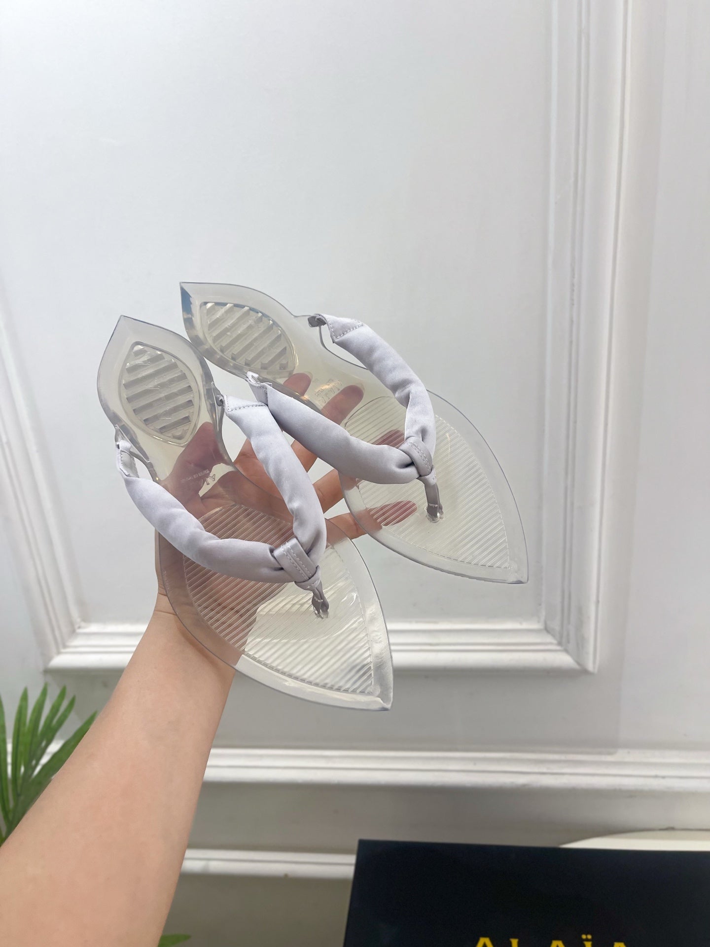 ALAIA 26S THONG SANDALS IN PEARL GREY SATIN AND TRANSPARENT PVC