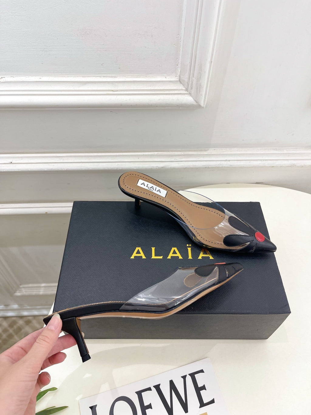 ALAIA 26S MULE HEELS 55 MM IN BLACK LAMBSKIN AND TRANSPARENT PVC