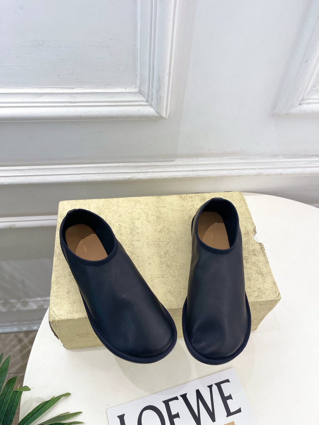 THE ROW 26S SLIP-ON FLATS IN BLACK NAPPA CALFSKIN