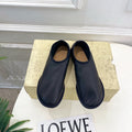 THE ROW 26S SLIP-ON FLATS IN BLACK NAPPA CALFSKIN