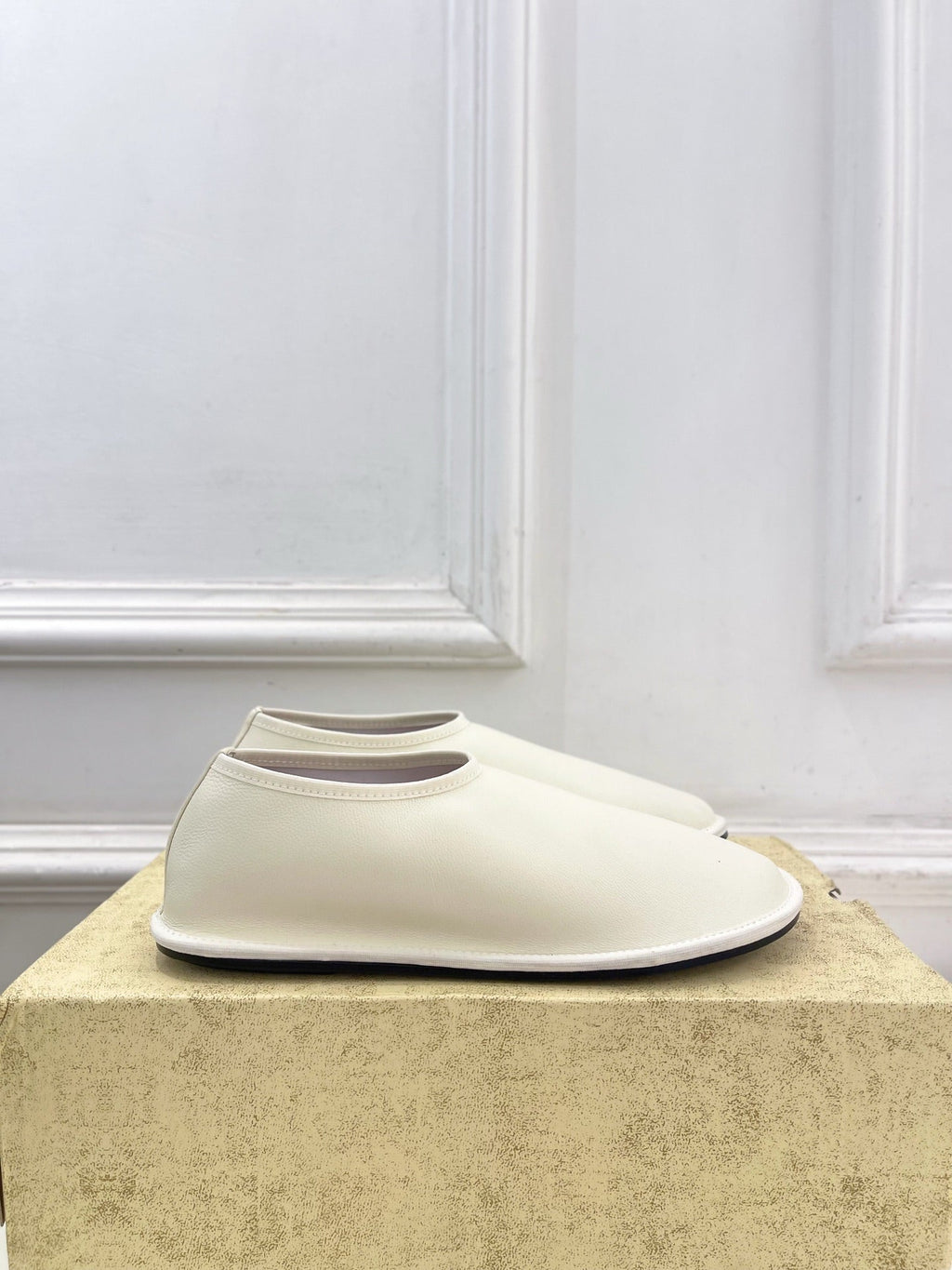 THE ROW 26S SLIP-ON FLATS IN WHITE NAPPA CALFSKIN
