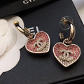 CHANEL 26S DOUBLE C LOGO TWO-TONE PAVE CRYSTAL HEART DROP HOOP EARRINGS IN GOLD METAL 631080