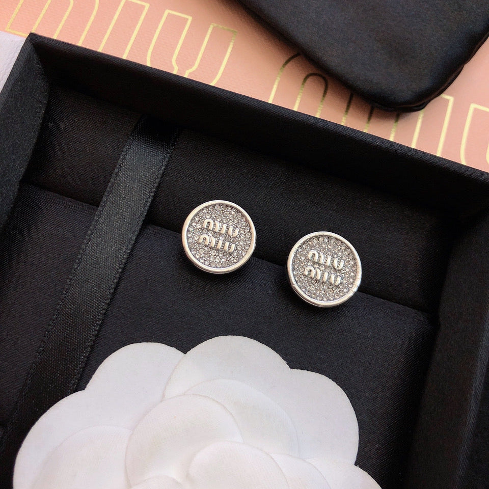 MIUMIU 26S CRYSTAL MIU LOGO ROUND STUD EARRINGS IN SILVER TONE METAL 630845
