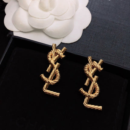 YSL 26S TWISTED ROPE LOGO STUD EARRINGS IN GOLD TONE METAL 629135
