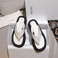 THE ROW 26S GINZA THONG SANDALS IN WHITE CALFSKIN AND BLACK SUEDE