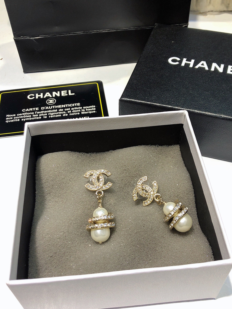CHANEL 26S DOUBLE C LOGO PAVE CRYSTAL DROP EARRINGS WITH PEARL CHARM IN GOLD METAL 633339