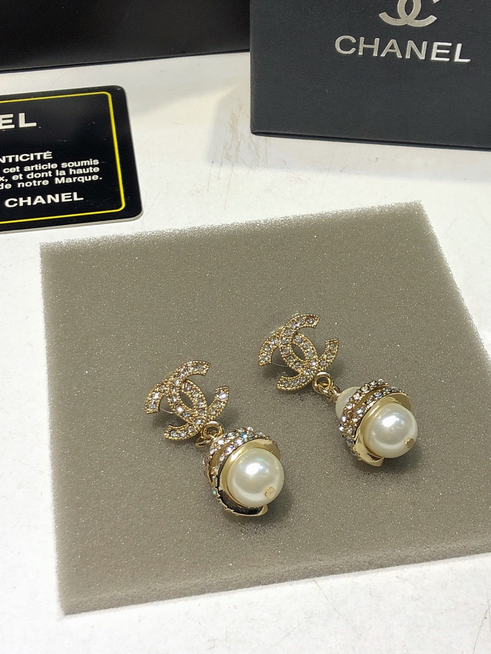 CHANEL 26S DOUBLE C LOGO PAVE CRYSTAL DROP EARRINGS WITH PEARL CHARM IN GOLD METAL 633339